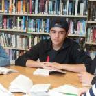 Group of high school students in school library setting