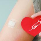 image of person's arm with a bandaid on it.