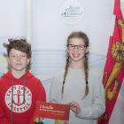 Linda Lowther (left) and Georges Arsenault, co-authors of the book L’Acadie de l Île-du-Prince-Édouard: 300 ans d’histoire, stand with students from École St-Augustin at the book's recent launch 