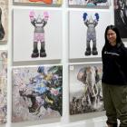 image of a person standing in front of artwork images