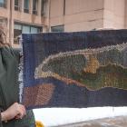 Rilla Marshall displays her artwork, a handwoven and embroidered work entitled Greenwich Peninsula, PEI