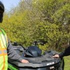 PEI ATV Federation president Peter Mellish and Conservation Officer Wade MacKinnon  stand outside beside an All Terrain Vehicle