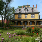 Summer photo of Beaconsfield Historic House at the corner of Kent and West streets.