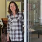 Beth Peters at her passive solar house in Long River