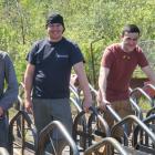 Holland College students standing behind a set of bike racks they built.