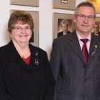 Photos shows Minister Robert Henderson standing with three women.