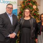 Minister Myers stands with two women at the Cleantech Park open house. 