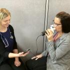 Heather Cyr administers a spirometry test.