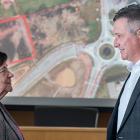 Cornwall Mayor Minerva McCourt and Finance Minister Heath MacDonald stand in front of a map showing where new housing will be built