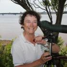 Museum and Heritage Foundation board member Diane Griffin looks at shore birds from the banks of her east river property.