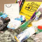 The photo shows a number of items that should be included in an emergency preparedness kit.