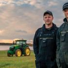 Brothers Bryan and Kyle Maynard of Arlington stand in field with tractor in background