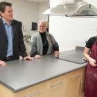 Photo shows ministers speaking with students in the newly renovated culinary arts kitchen.