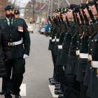 Photo shows lieutenant governor reviewing honor guard