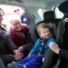 Summerside mom and child get tips on car seat safety along with Minister Paula Biggar,  Summerside Police Cpl. Jennifer Driscoll and Highway Safety Officer Kevin Gillian