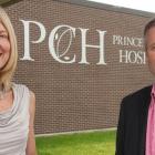 Minister Robert Henderson and Dr. Michele Barton outside Prince County Hospital