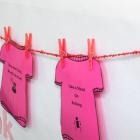 A line of pink shirt cut-outs to promote kindness on Pink Shirt Day