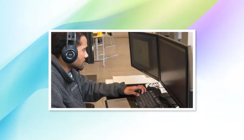 Young male works on computer