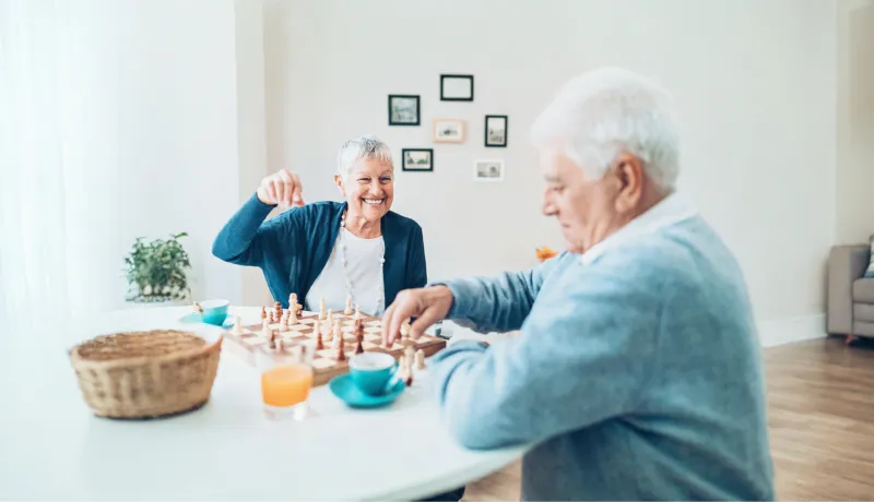 senior couple playing chess