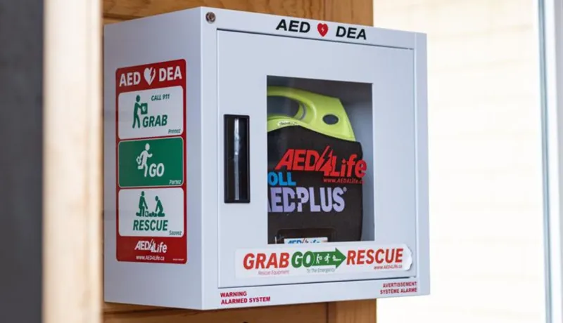 An Automated External Defibrillator (AED) on a wall.