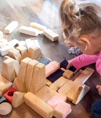 little girl playing with blocks