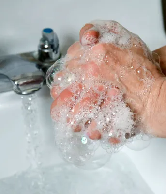 a person washing their hands