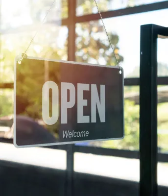 Open sign displayed in a window