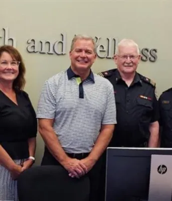 Five men and one woman stand next to each other.
