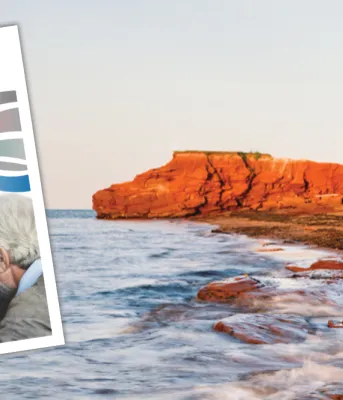 Thumbnail image of Poverty Reduction Action Plan for PEI cover in foreground with image of red cliffs of PEI coastline in background