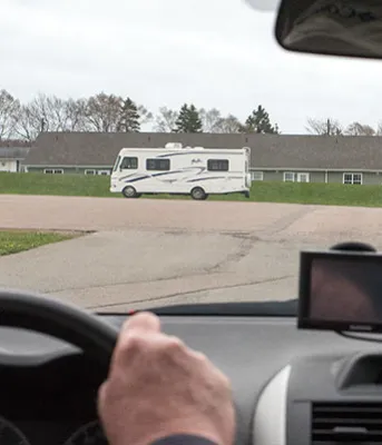 Vehicle driver sees cyclist ahead 