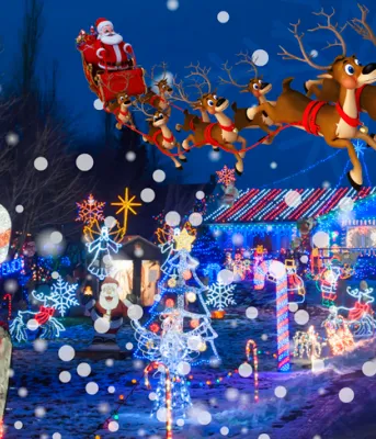 Santa in his sleigh flying over a Christmas decorated house