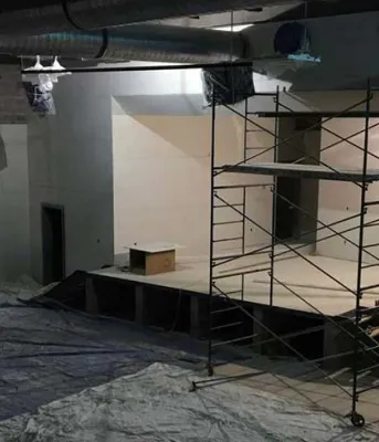 Photo shows interior construction of a large space at the new French school.