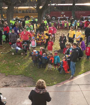 Minister Currie speaks to hundreds of children outside of the legislature.