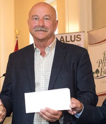 Minister Robert Henderson, ALUS Canada CEO Bryan Gilvesy, Minister Richard Brown.