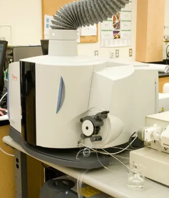 Woman works in a laboratory with shiny new equipment.