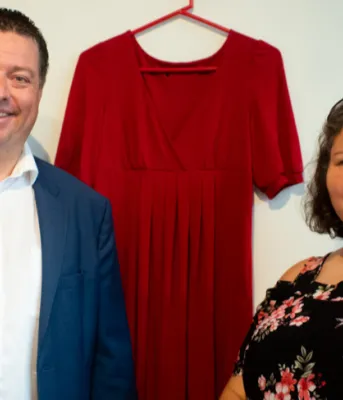 A man and a woman standing beside each other