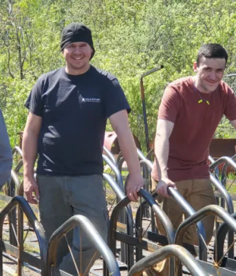 Holland College students standing behind a set of bike racks they built.