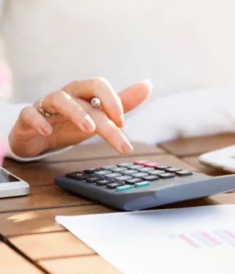 image of a person using a calculator