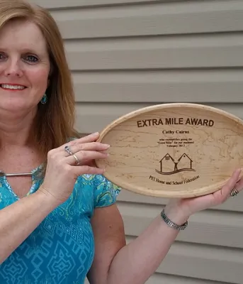 Cathy Cairns with her Extra Mile award