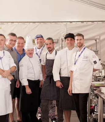 Group of six chefs standing at Chef's Challenge