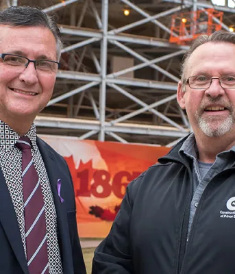 Minister Heath MacDonald stands with Sam Sanderson, general manager of the Construction Association of PEI
