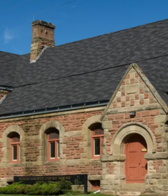 Photograph of the Kings County Courthouse with a blue sky in the background