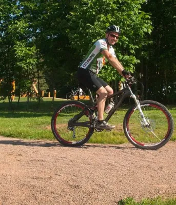 image of two people on mountain bikes on a trail.