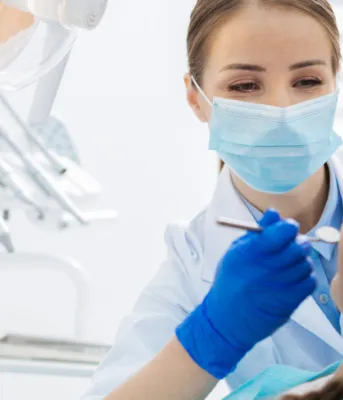 dentist looking at someones teeth