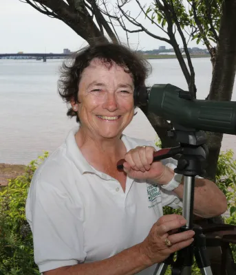 Museum and Heritage Foundation board member Diane Griffin looks at shore birds from the banks of her east river property.
