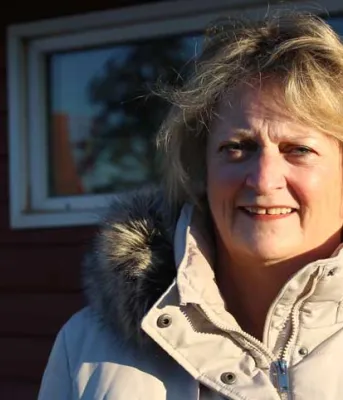 This photo shows cancer survivor Donna Gallant, standing outside in winter. 