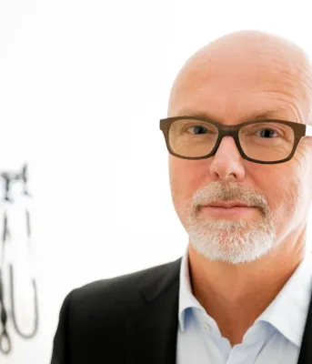 image of person in a room with medical instruments on the wall