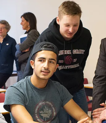 Photo shows ministers Jordan Brown and Heath MacDonald with students