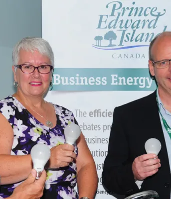 Corey Arsenault of Stretch Fitness with Transportation, Minister Paula Biggar and Mike Proud of efficiencyPEI.