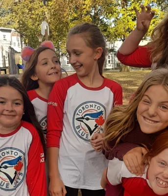 Ball players from the Girls at Bat program